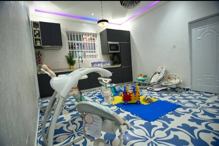 Calm early years room arranged for safe care and routines